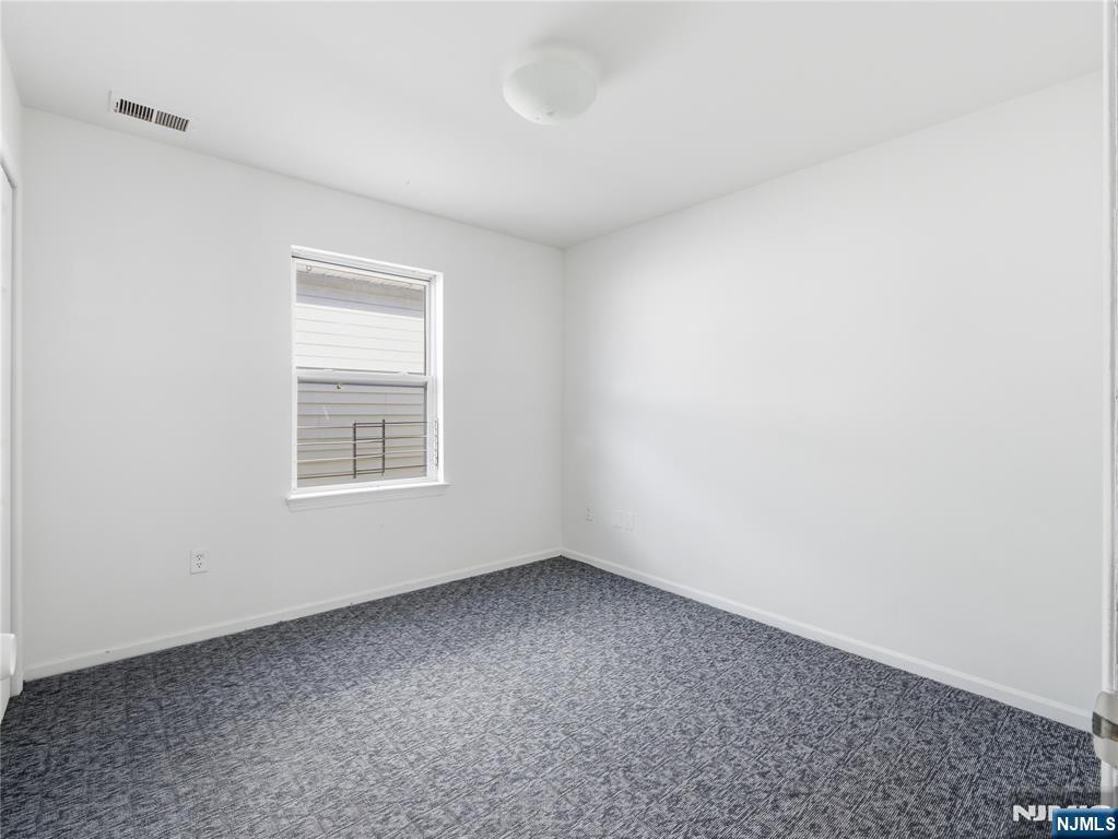 55 Lincoln Avenue, Unit 2 Newark, NJ 07104 - Photo 13 of 21 an empty room with a window