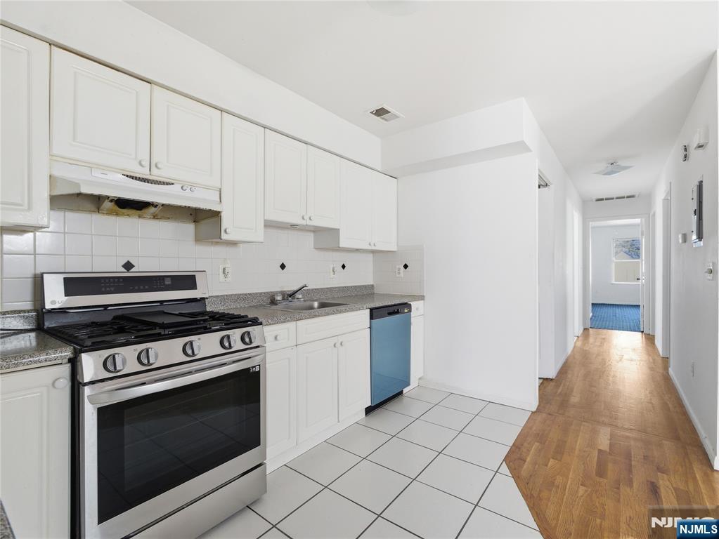 55 Lincoln Avenue, Unit 2 Newark, NJ 07104 - Photo 9 of 21 a kitchen with a stove and a sink