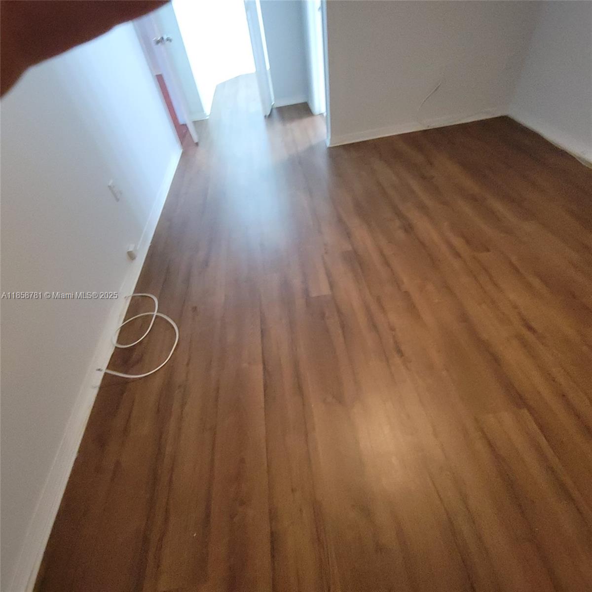 711 Southwest 111th Way, Unit 3017 Pembroke Pines, FL 33025 - Photo 15 of 20 a view of a room with wooden floor and stairs