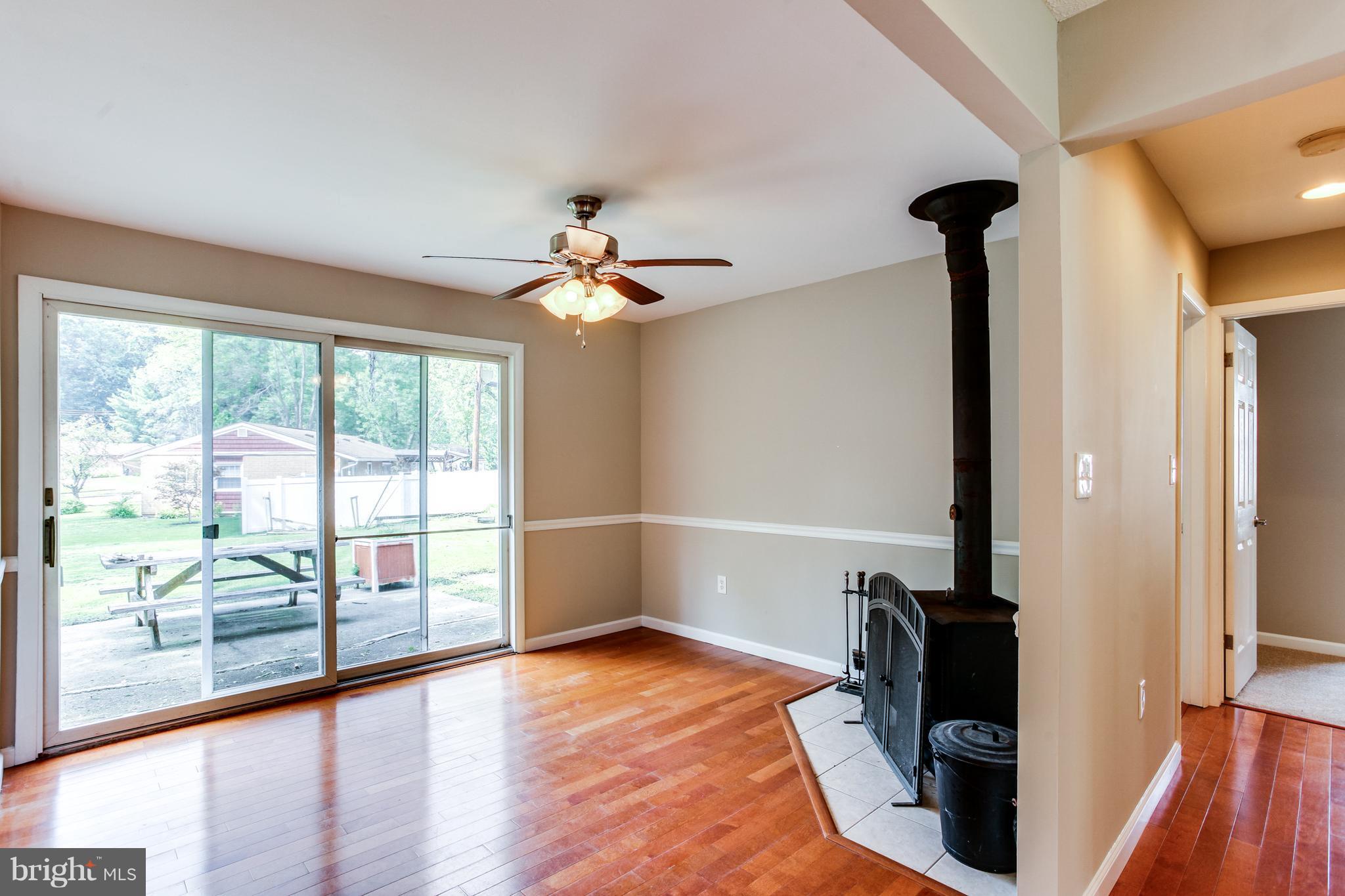 410 Trimble Road Joppa, MD 21085 - Photo 7 of 26 Dining Room has wood burning stove & slider