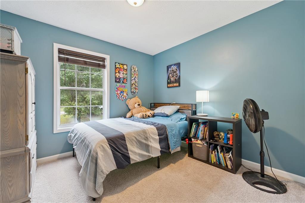 8020 Estee Drive Cumming, GA 30028 - Photo 23 of 41 a bed room with a bed and a window