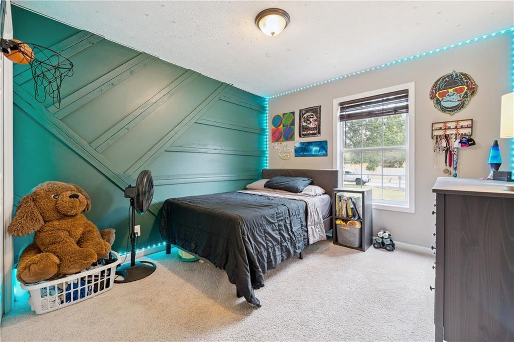 8020 Estee Drive Cumming, GA 30028 - Photo 25 of 41 a bedroom with a bed and a window