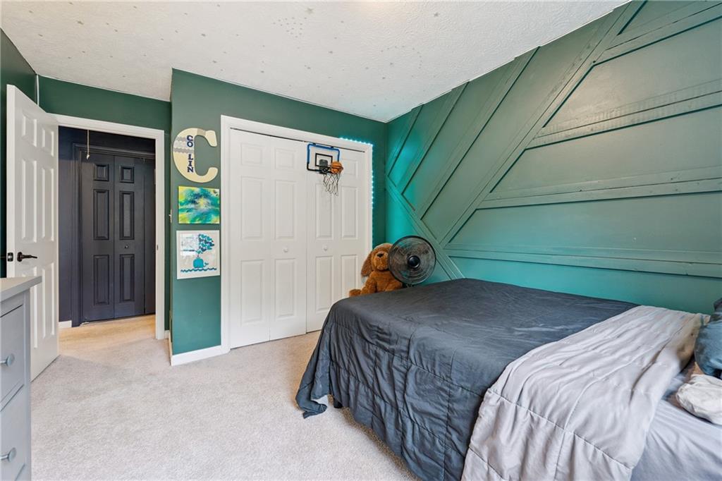 8020 Estee Drive Cumming, GA 30028 - Photo 26 of 41 a bedroom with a bed and a window
