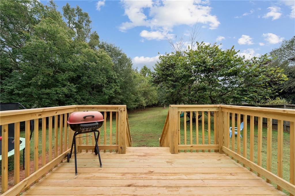 8020 Estee Drive Cumming, GA 30028 - Photo 29 of 41 a balcony with wooden floor and outdoor space