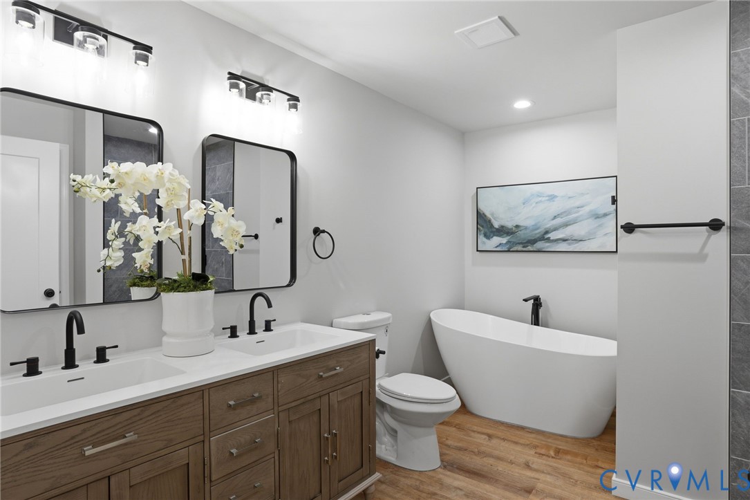 3490 Willow Brook Road Bumpass, VA 23024 - Photo 15 of 29 a bathroom with a toilet sink and mirror