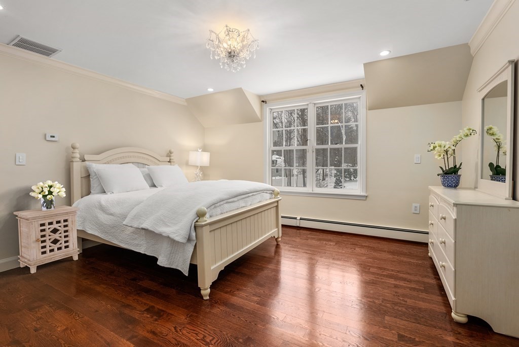 30 Hillcrest Road Weston, MA 02493 - Photo 15 of 29 a bedroom with a bed and a window with wooden floor