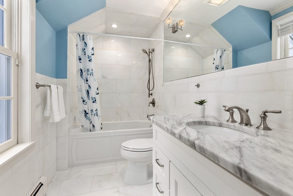 30 Hillcrest Road Weston, MA 02493 - Photo 16 of 29 a bathroom with a granite countertop sink a toilet a mirror a vanity and bathtub