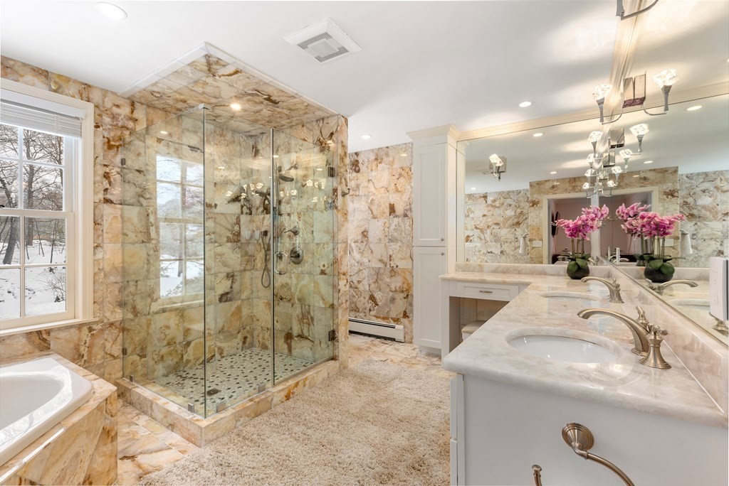 30 Hillcrest Road Weston, MA 02493 - Photo 18 of 29 a bathroom with a granite countertop sink a mirror and shower