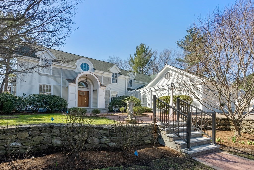 30 Hillcrest Road Weston, MA 02493 - Photo 2 of 29 a front view of a house with a garden