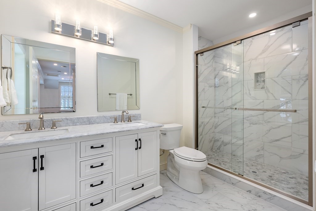 30 Hillcrest Road Weston, MA 02493 - Photo 24 of 29 a bathroom with a granite countertop sink a toilet and a mirror
