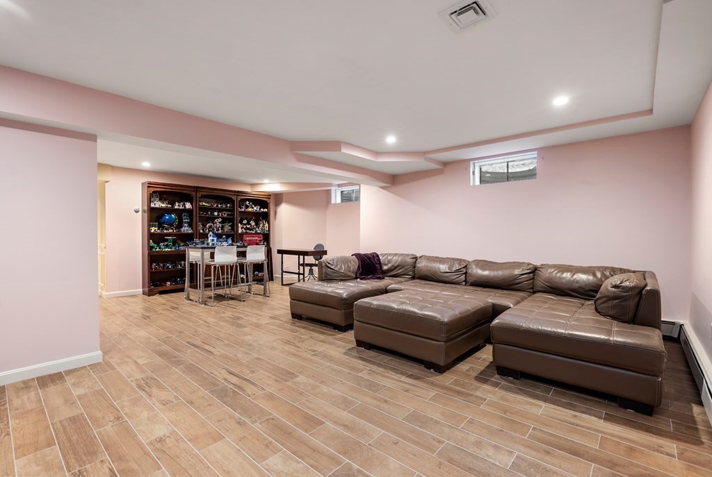 30 Hillcrest Road Weston, MA 02493 - Photo 25 of 29 a living room with furniture and a wooden floor
