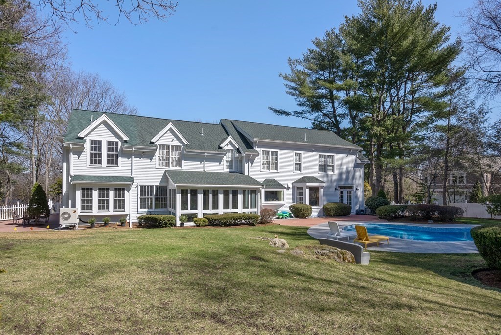 30 Hillcrest Road Weston, MA 02493 - Photo 28 of 29 a front view of residential houses with yard and green space
