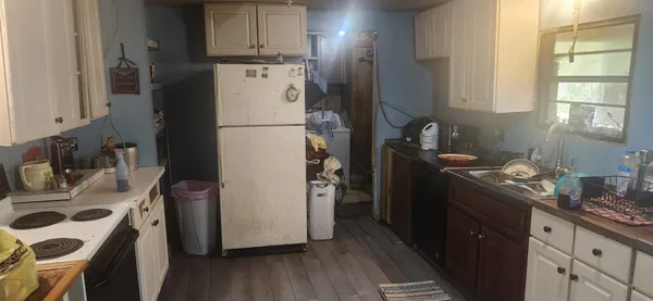 a view of a workspace with furniture and a mirror