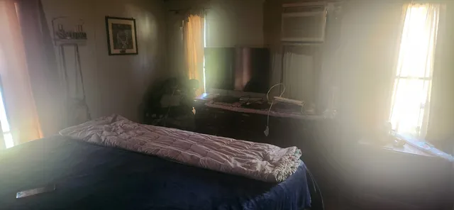 a white toilet sitting next to a bathroom sink and vanity