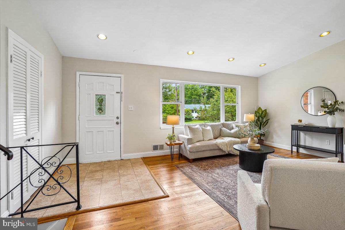 827 Caddington Avenue Silver Spring, MD 20901 - Photo 5 of 45 a living room with furniture and a large window