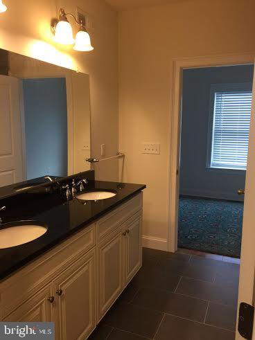 4080 Spring Garden Street Philadelphia, PA 19104 - Photo 22 of 28 Elegant dual-sink bathroom retreat.