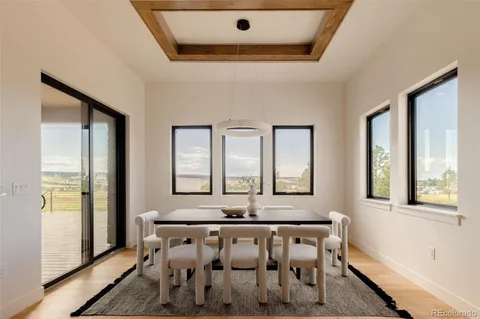 a view of a room with window and wooden floor