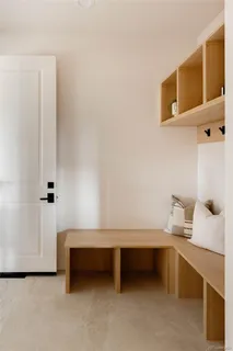 a bedroom with a bed and a table