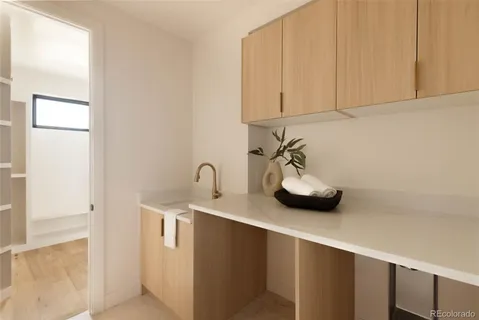 a kitchen with a sink and cabinets