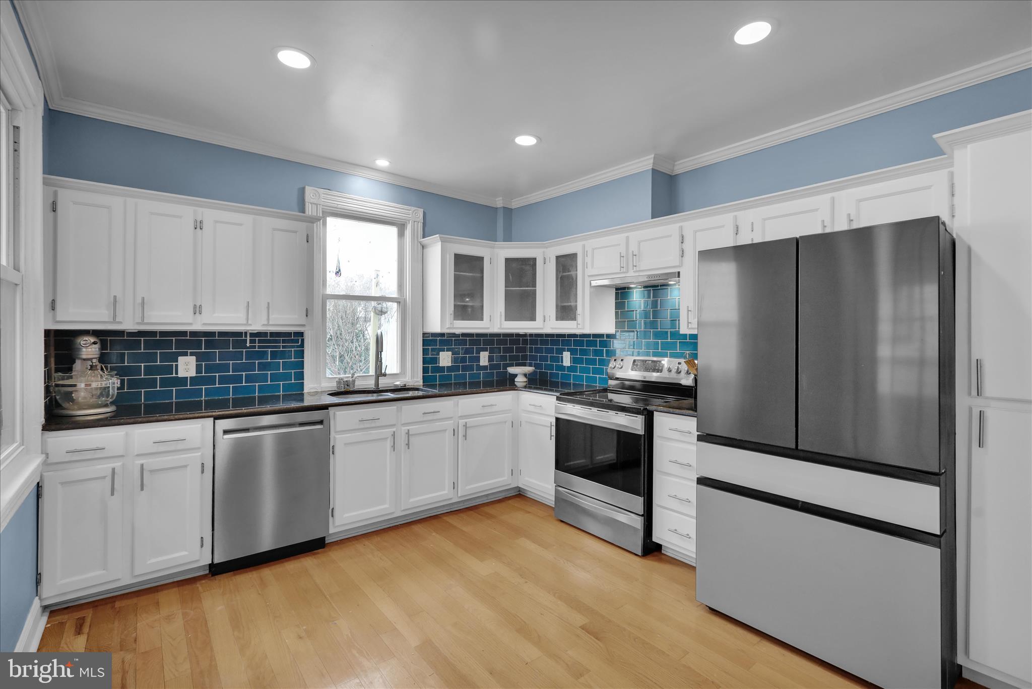 431 East Orange Street Lancaster, PA 17602 - Photo 16 of 46 a kitchen with granite countertop white cabinets and stainless steel appliances