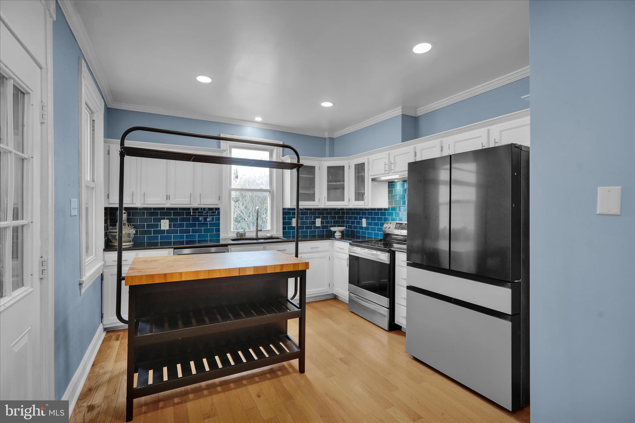 431 East Orange Street Lancaster, PA 17602 - Photo 17 of 46 a kitchen with stainless steel appliances granite countertop a refrigerator and a stove top oven