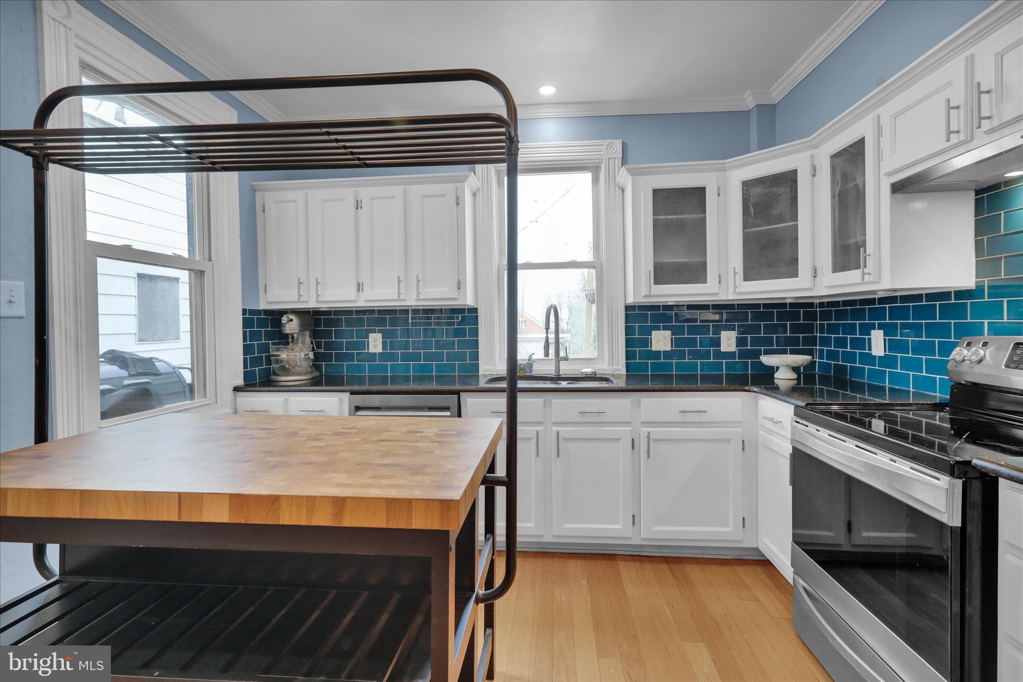431 East Orange Street Lancaster, PA 17602 - Photo 19 of 46 a kitchen with stainless steel appliances a stove and cabinets