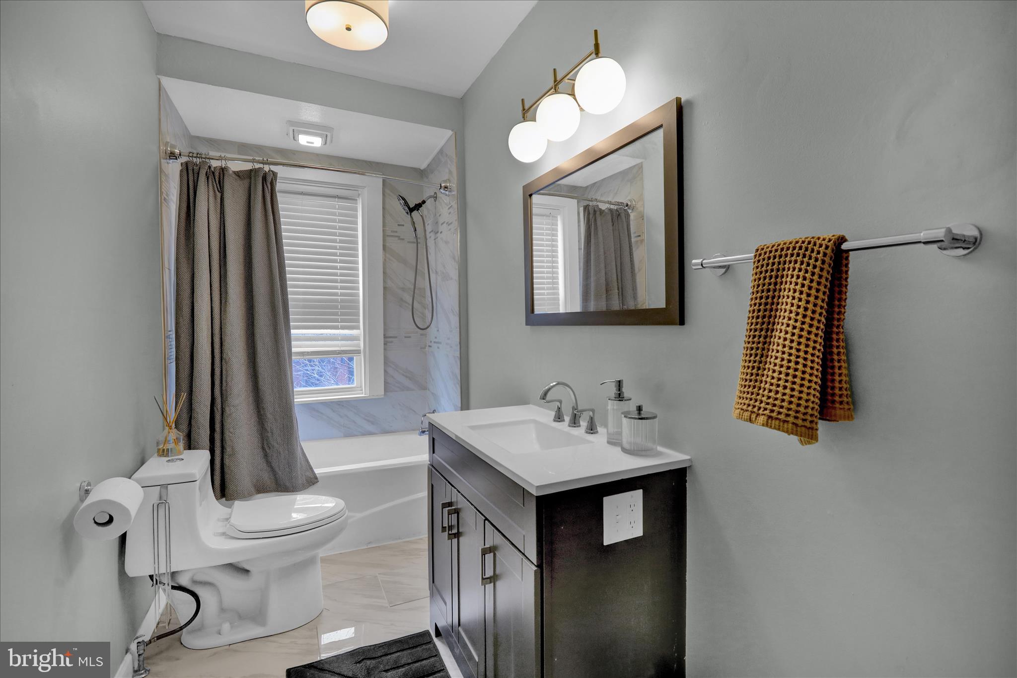 431 East Orange Street Lancaster, PA 17602 - Photo 26 of 46 a bathroom with a sink a toilet and mirror