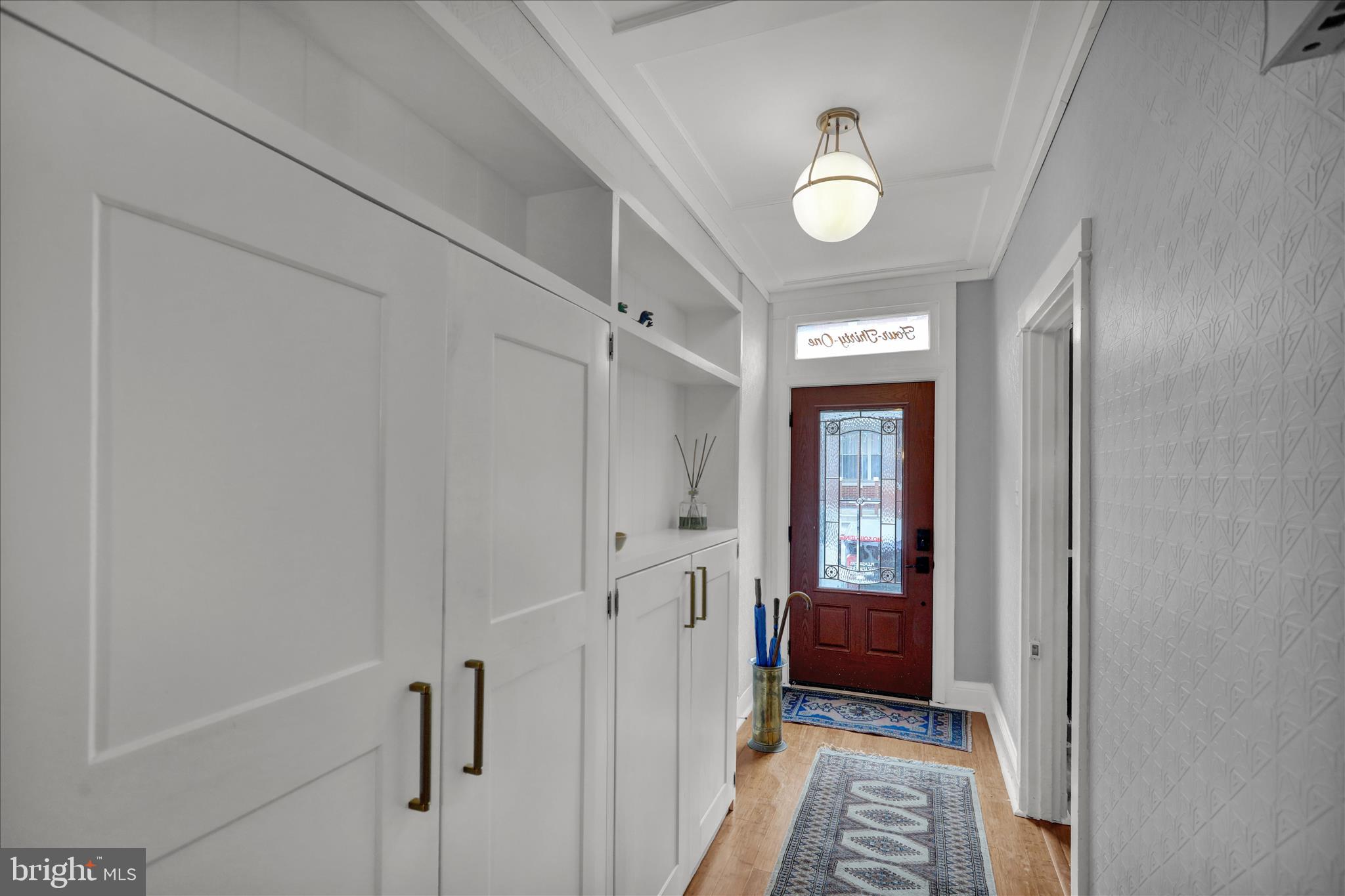 431 East Orange Street Lancaster, PA 17602 - Photo 5 of 46 a view of a hallway with wooden floor and cabinet