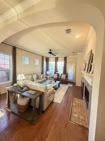 a large white kitchen with a large window