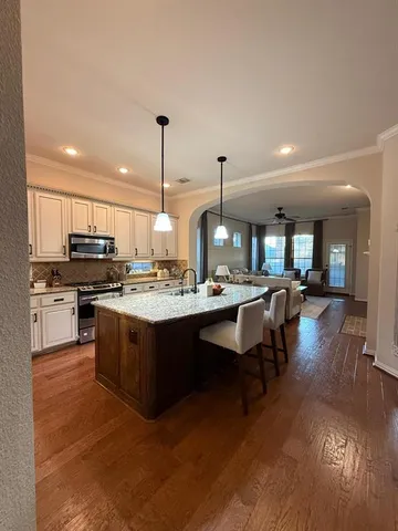 a kitchen with a sink counter top space and appliances