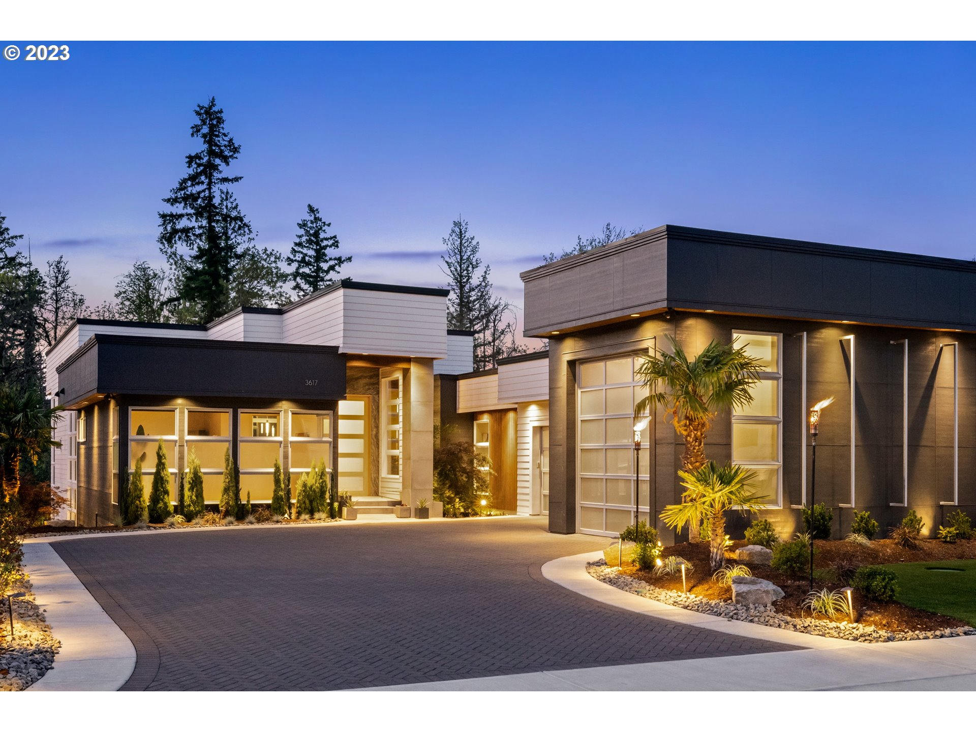 a front view of a house with outdoor seating