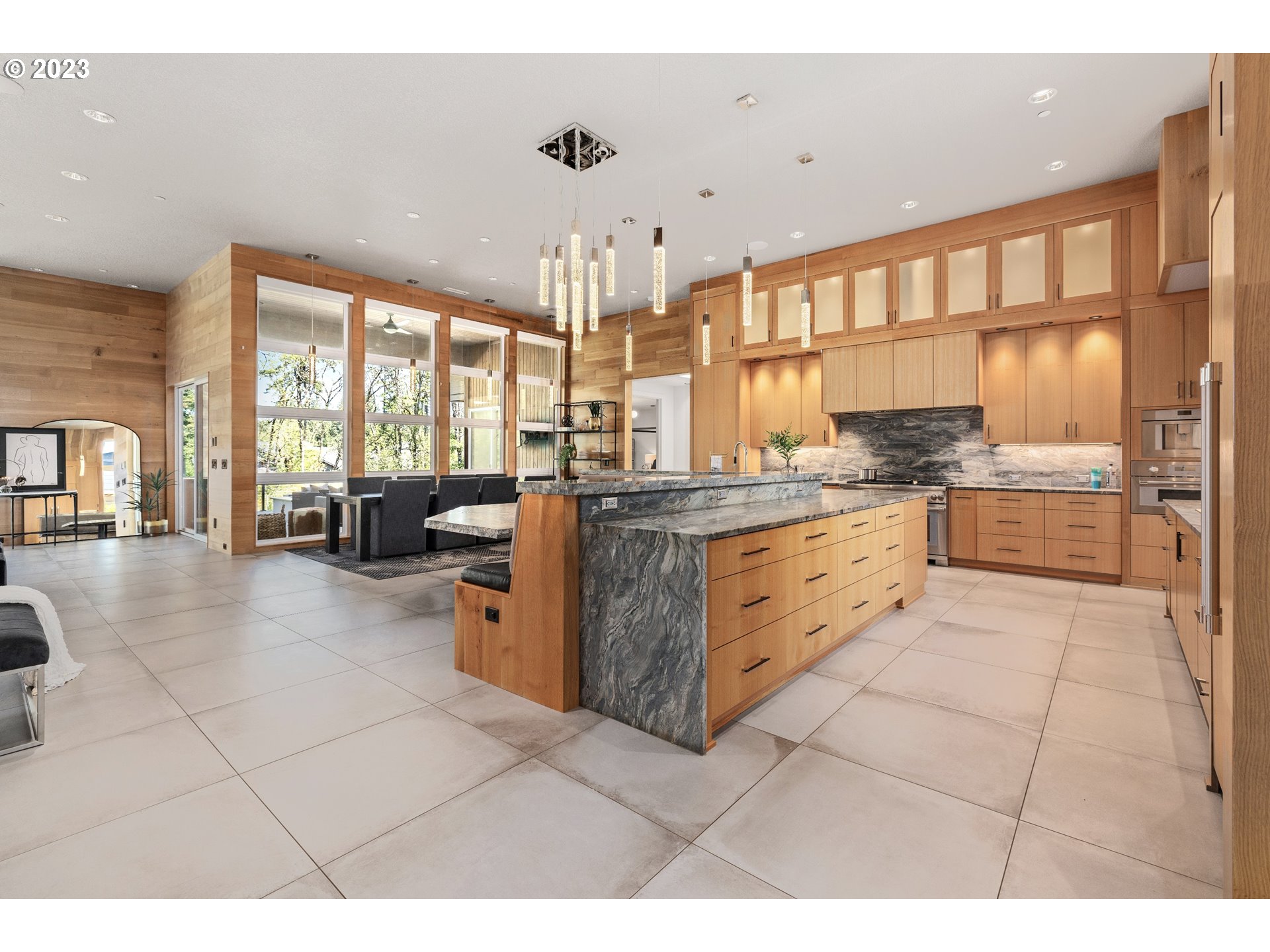 3617 Northwest McMaster Drive Camas, WA 98607 - Photo 6 of 48 a large kitchen with kitchen island granite countertop a large counter top space a sink a counter top space and cabinets