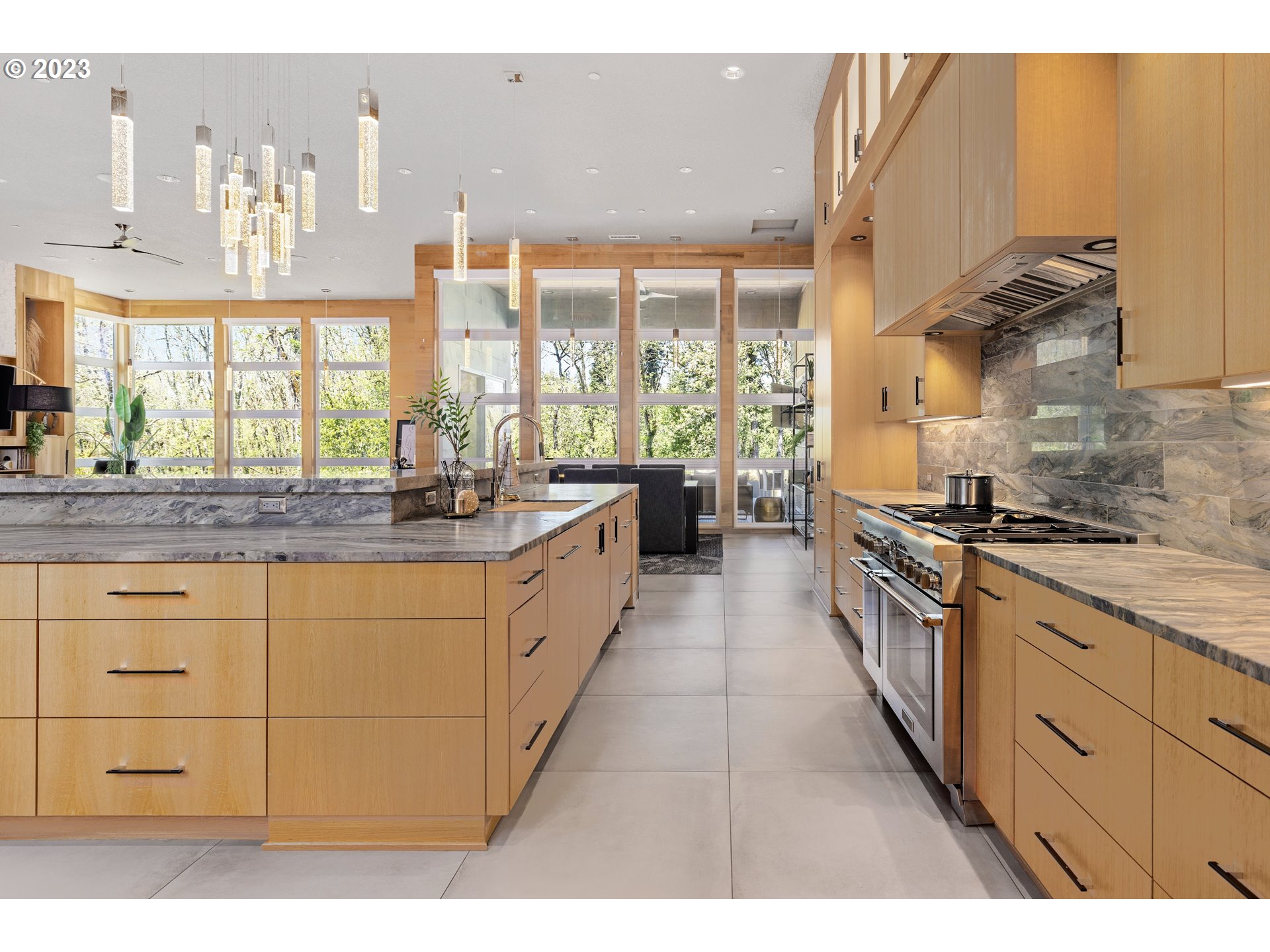 3617 Northwest McMaster Drive Camas, WA 98607 - Photo 9 of 48 a large kitchen with kitchen island granite countertop a large window