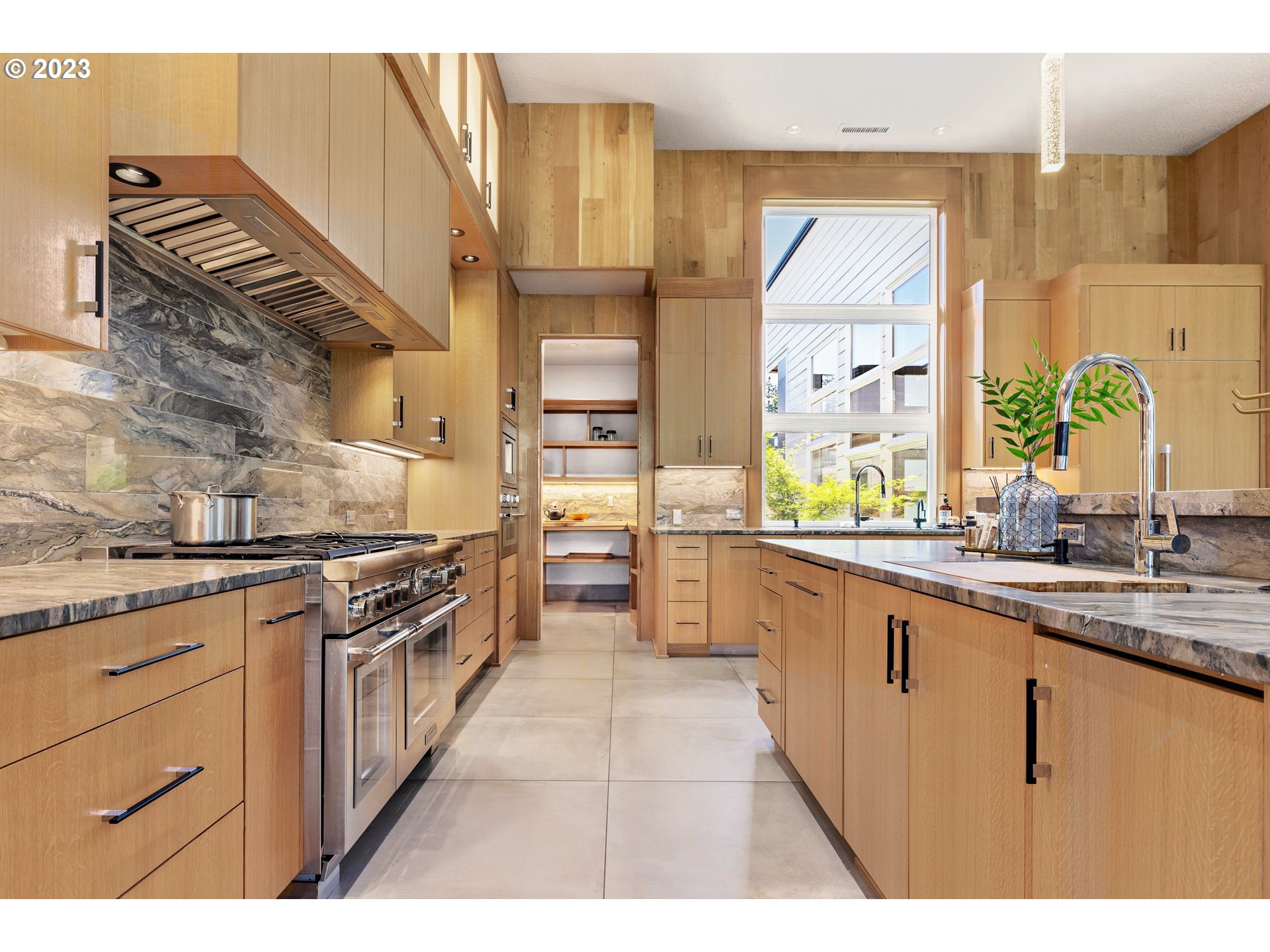 3617 Northwest McMaster Drive Camas, WA 98607 - Photo 10 of 48 a kitchen with stainless steel appliances granite countertop a stove a sink and a microwave