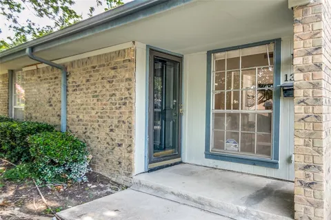 a front view of a house with a glass door