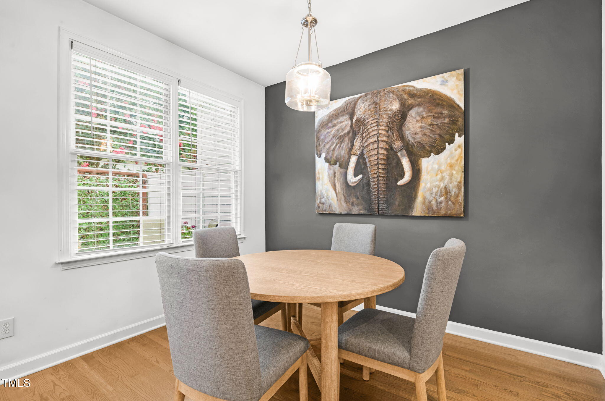 4555 Treerose Way Raleigh, NC 27606 - Photo 12 of 37 a view of a dining room with furniture window and wooden floor
