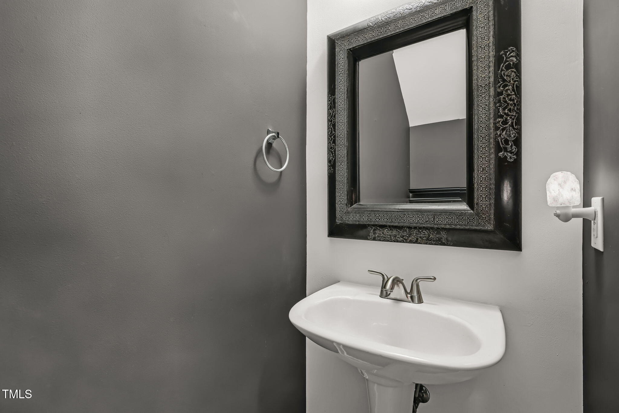 4555 Treerose Way Raleigh, NC 27606 - Photo 16 of 37 a bathroom with a sink and a mirror