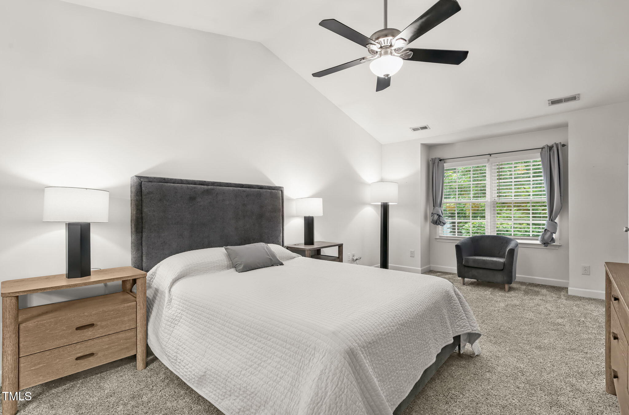 4555 Treerose Way Raleigh, NC 27606 - Photo 17 of 37 a bedroom with a bed and window