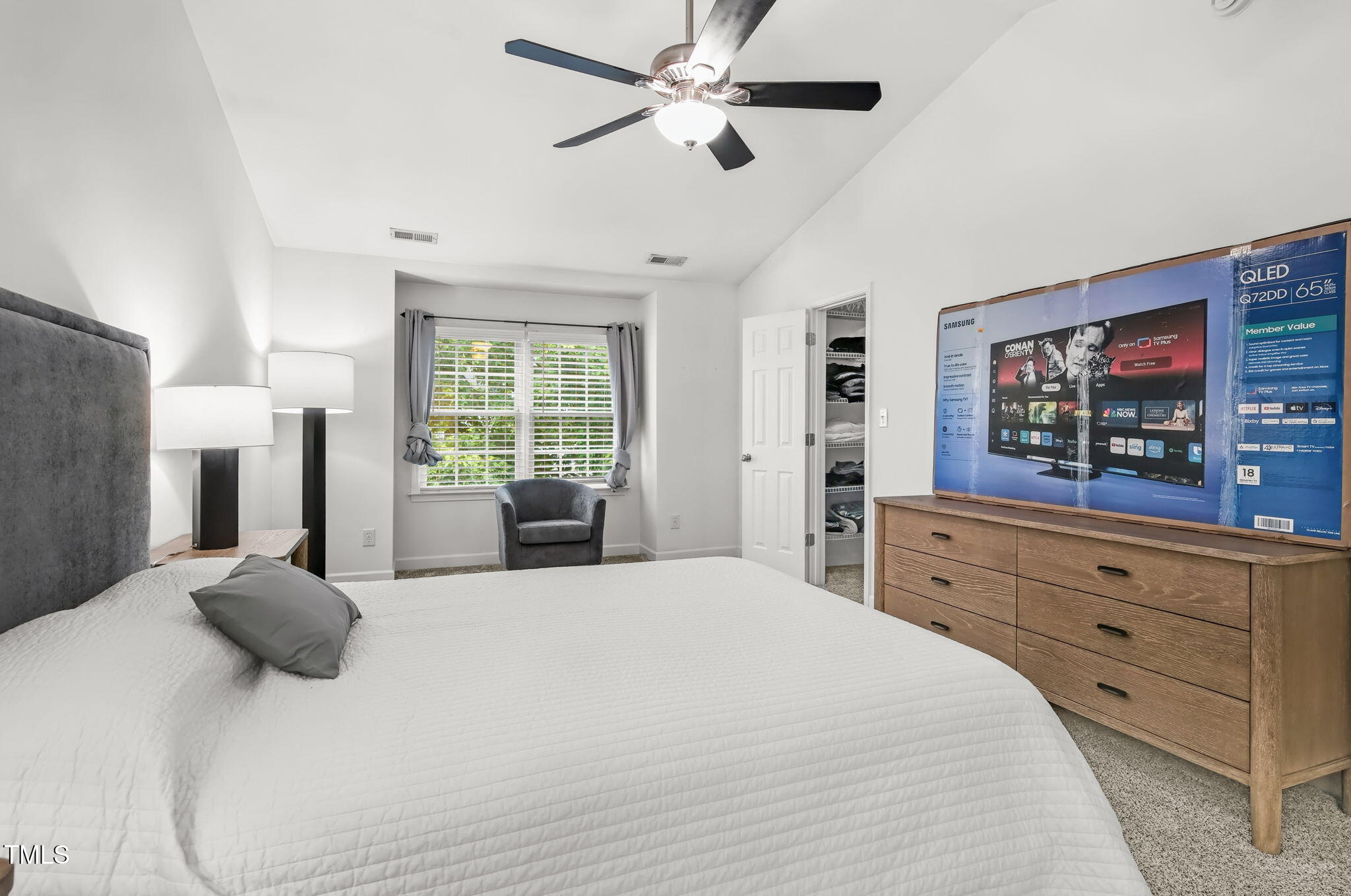 4555 Treerose Way Raleigh, NC 27606 - Photo 18 of 37 a bedroom with a large bed and a window