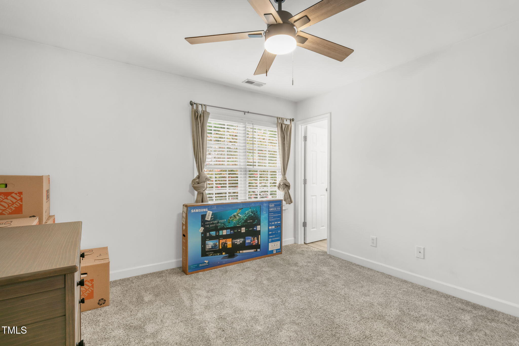 4555 Treerose Way Raleigh, NC 27606 - Photo 26 of 37 an empty room with windows and fan