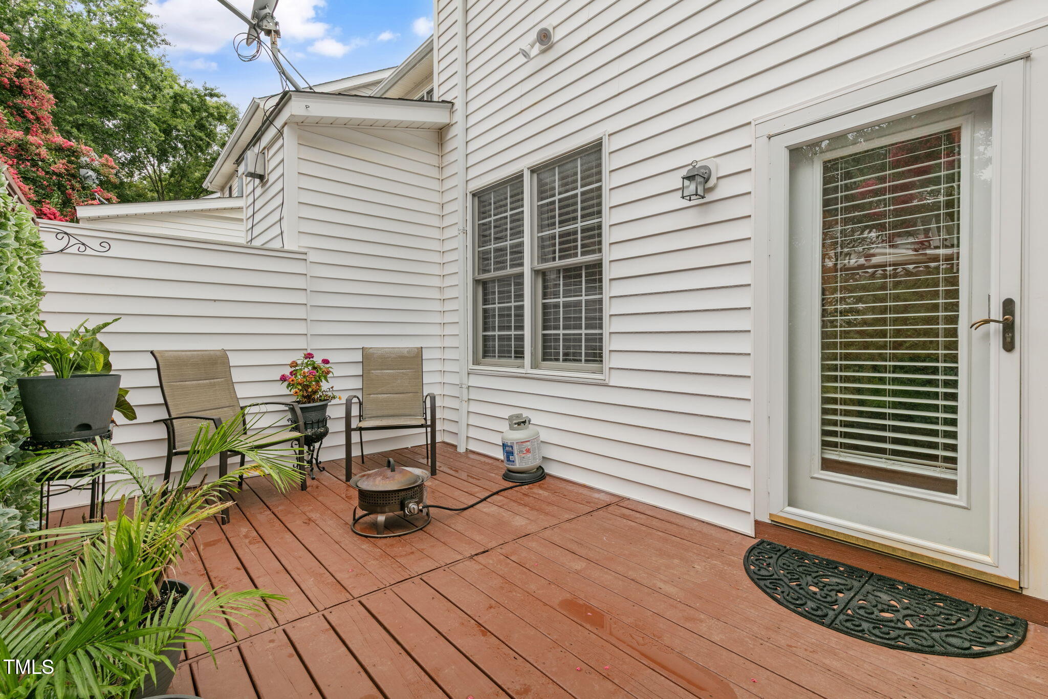 4555 Treerose Way Raleigh, NC 27606 - Photo 29 of 37 a view of a deck with table and chairs with wooden floor and fence