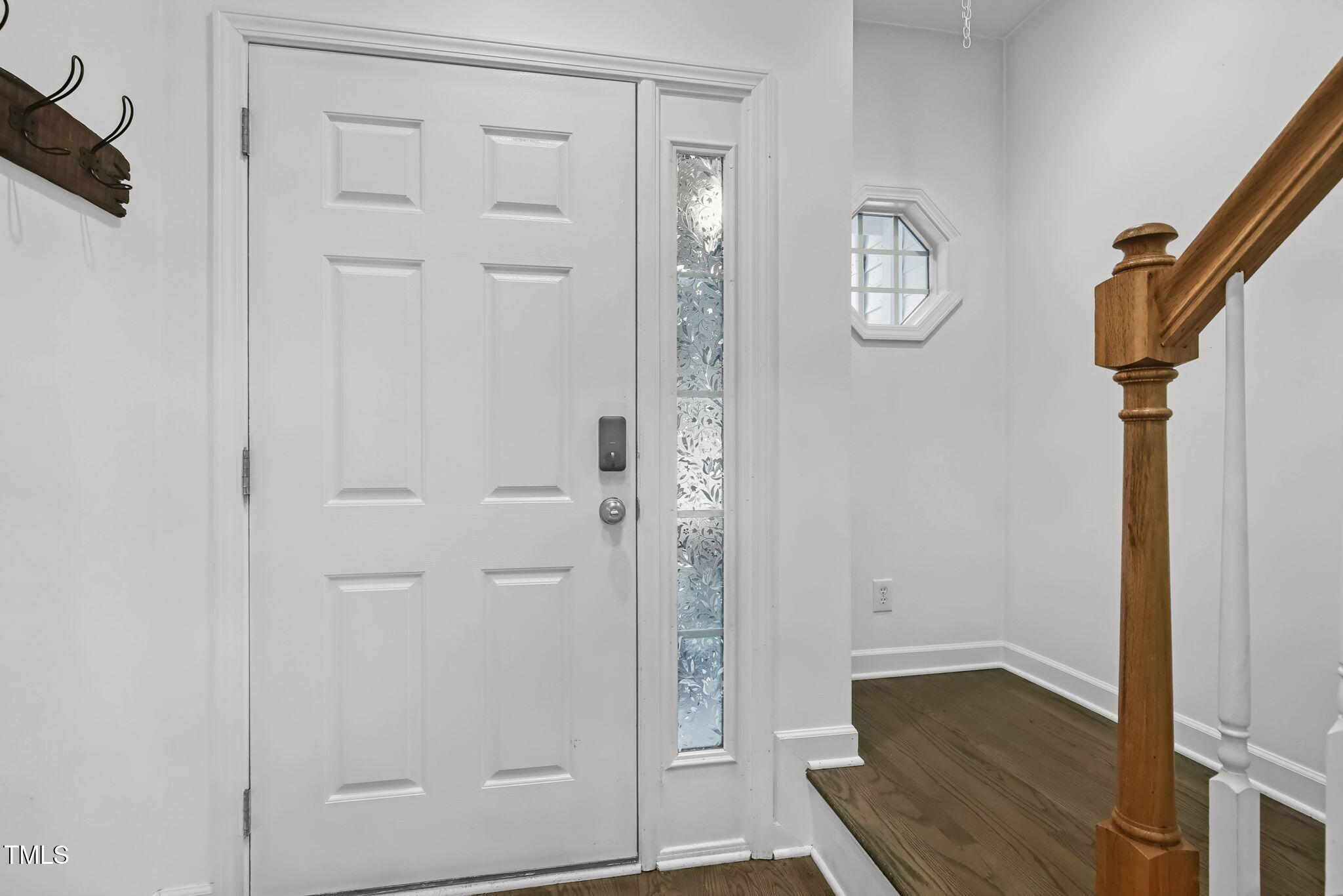 4555 Treerose Way Raleigh, NC 27606 - Photo 3 of 37 an empty room with wooden floor and mirror