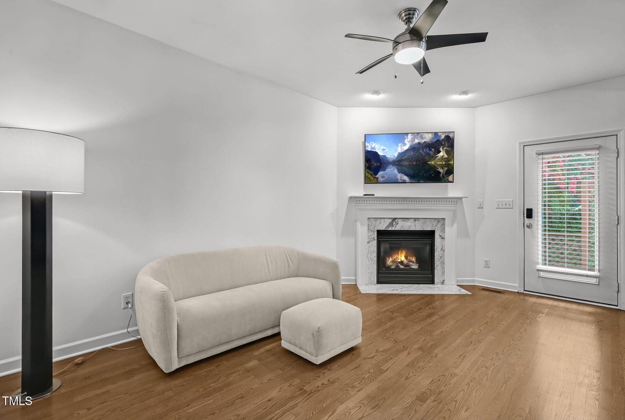 4555 Treerose Way Raleigh, NC 27606 - Photo 6 of 37 a living room with furniture and a fireplace