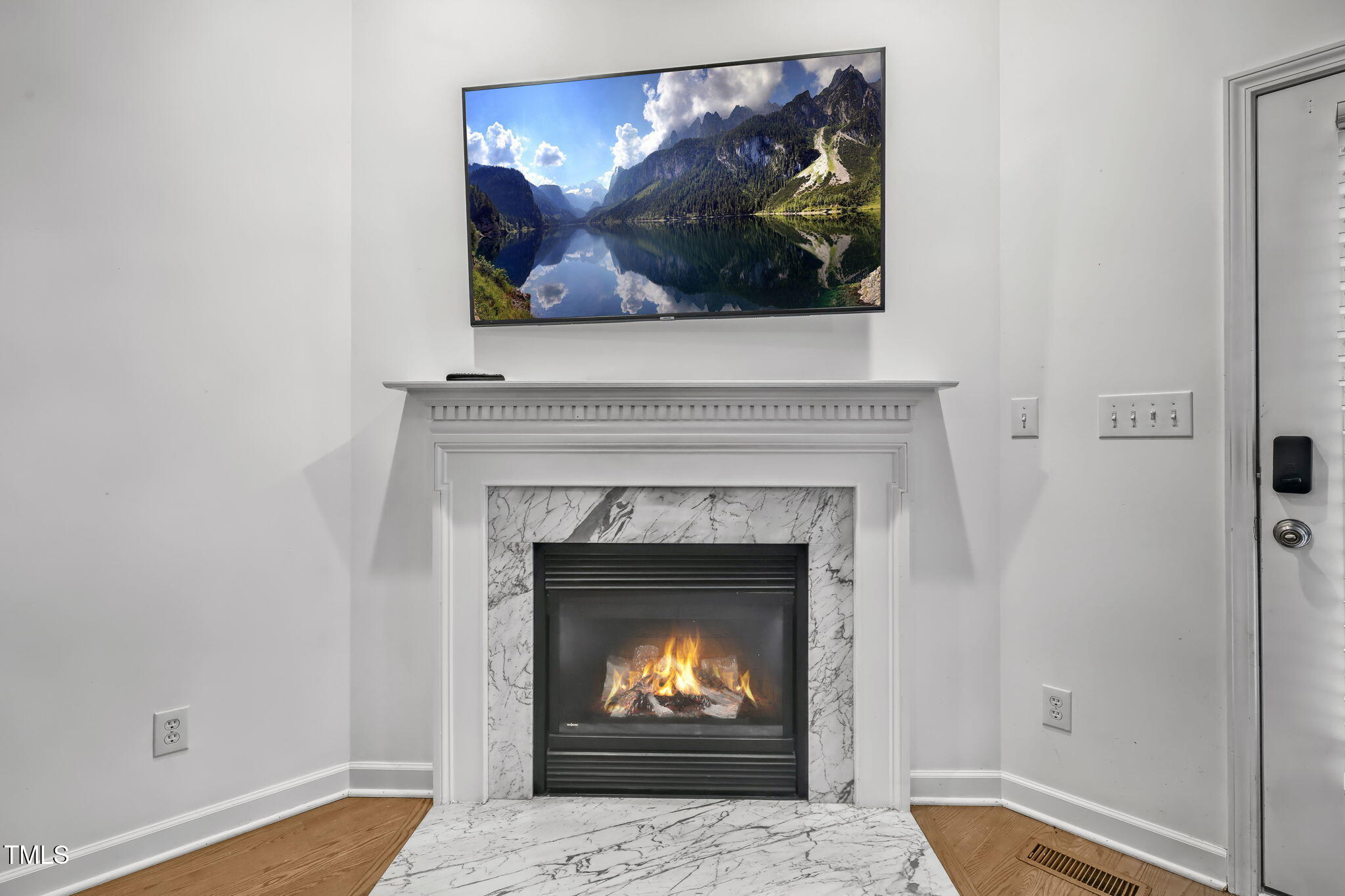 4555 Treerose Way Raleigh, NC 27606 - Photo 7 of 37 a living room with a fireplace