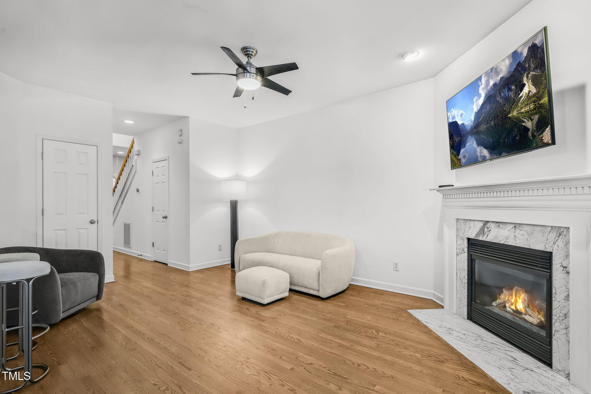 4555 Treerose Way Raleigh, NC 27606 - Photo 8 of 37 a living room with furniture and a fireplace