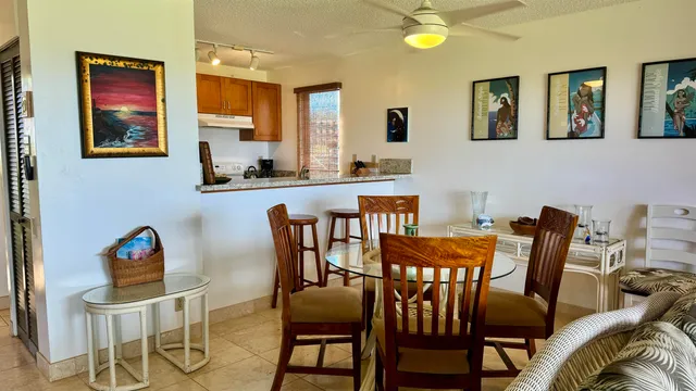 a view of a dining room with furniture and chandelier