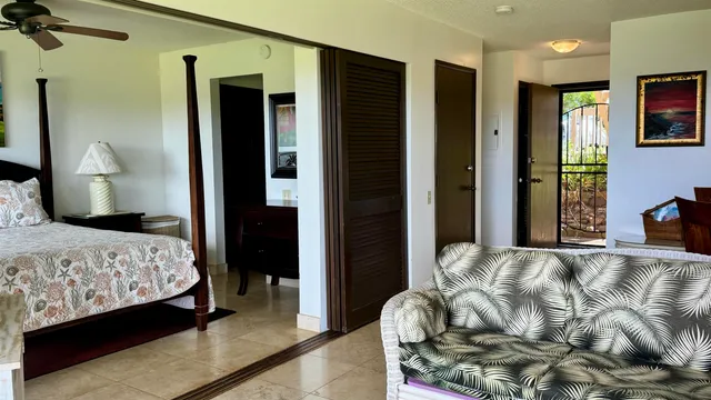 a living room with furniture gym equipment and a window