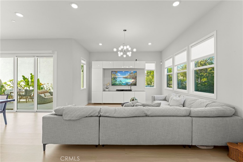 259 Chorus Irvine, CA 92618 - Photo 11 of 56 a living room with furniture and a large window