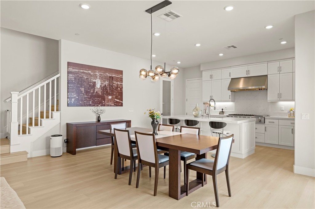 259 Chorus Irvine, CA 92618 - Photo 14 of 56 a view of a dining room with furniture and chandelier