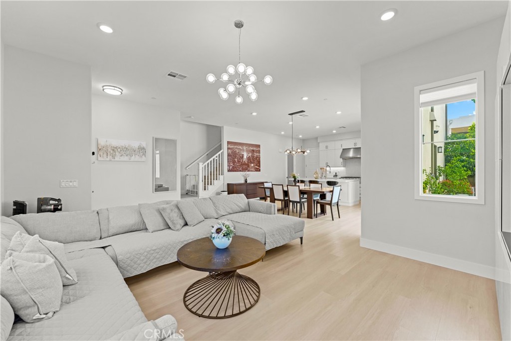 259 Chorus Irvine, CA 92618 - Photo 16 of 56 a living room with furniture and a large window